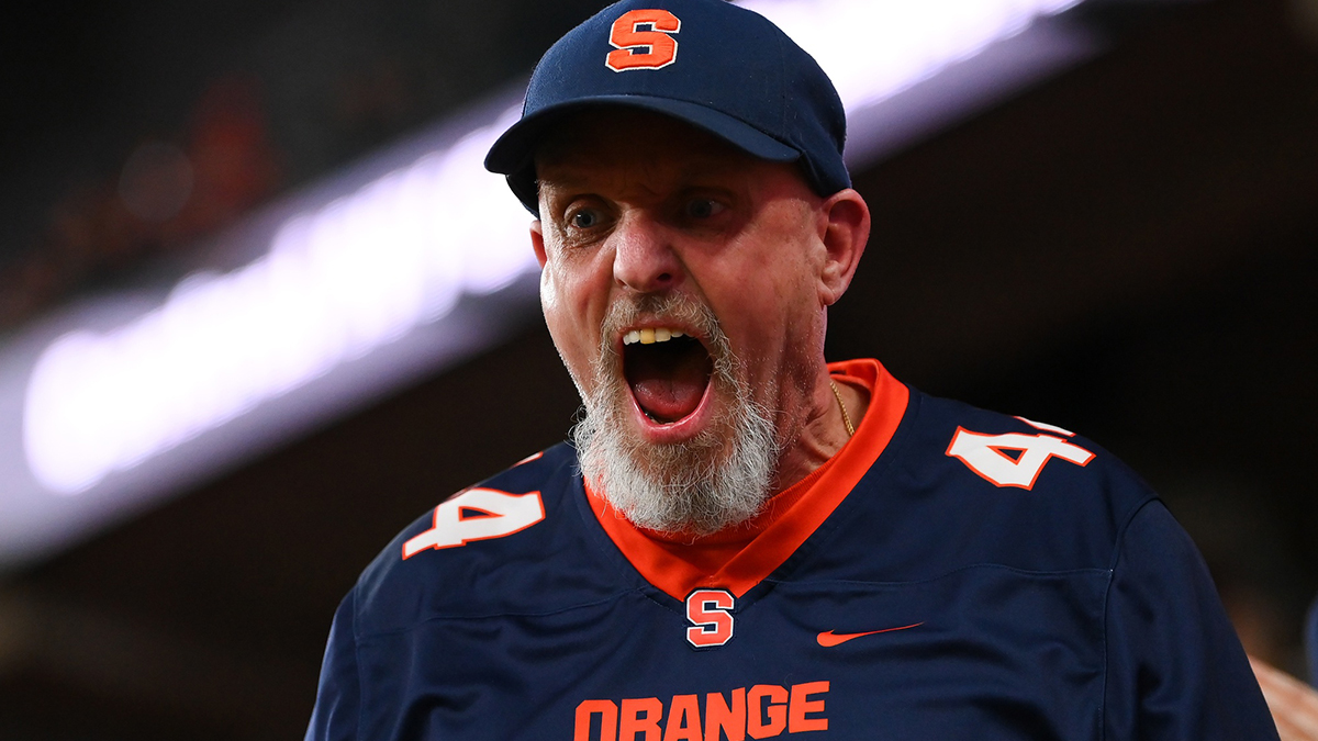 A Syracuse Orange fan reacts after a play against the Miami Hurricanes during the second halfat the JMA Wireless Dome