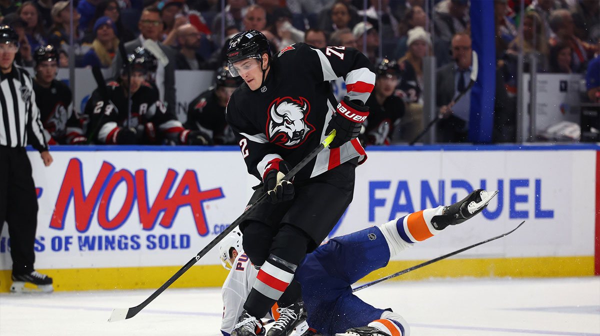 Buffalo Sabres center Tage Thompson (72) takes the puck from New York Islanders defenseman Ryan Pulock (6) during the third period at KeyBank Center.