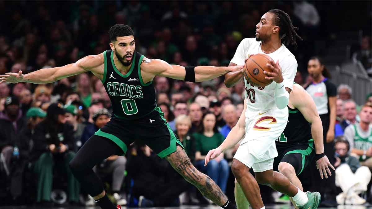 Boston Celtics forward Jayson Tatum (0) defends Cleveland Cavaliers guard Darius Garland (10) during the first half at TD Garden. 