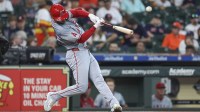 Los Angeles Angels left fielder Taylor Ward (3) hits a single during the first inning against the Houston Astros at Minute Maid Park.