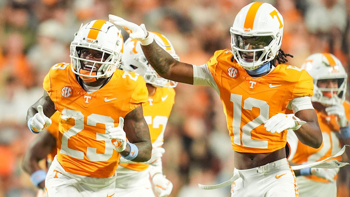 Tennessee Volunteers defensive back Boo Carter (23) and defensive back John Slaughter (12) celebrate after a play against the Mississippi State Bulldogs during the first half at Neyland Stadium.
