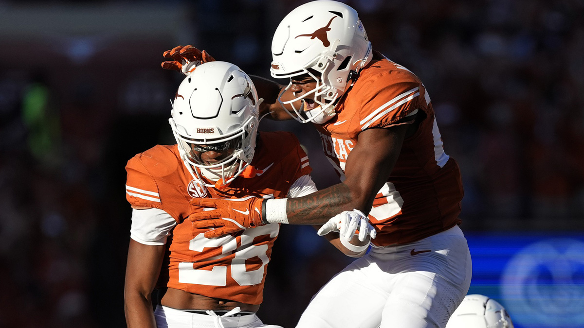Texas Longhorns defensive back Jelani McDonald (25) and linebacker Ty'Anthony Smith (26) react after an interception during the first half against the Kentucky Wildcats at Darrell K Royal-Texas Memorial Stadium.