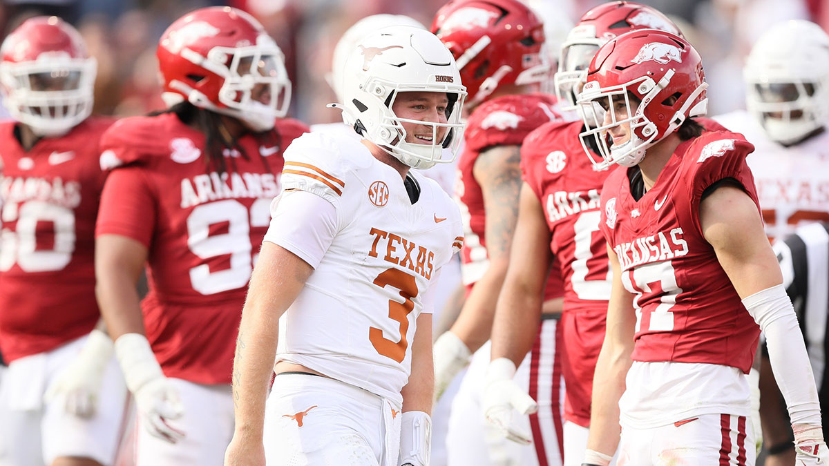 Texas Longhorns quarterback Quinn Ewers (3) celebrates after making a final first down to end the game against the Arkansas Razorbacks at Donald W. Reynolds Razorback Stadium. Texas won 20-10.