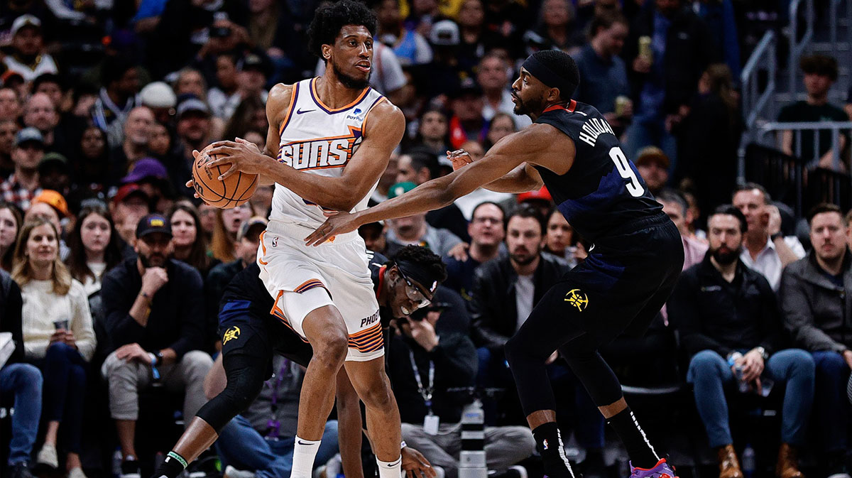 Phoenix Suns Forward Thaddeus Young (30) Controls the ball as Denver Nuggets forward Justin Holiday (9) guard in the second quarter of Ballley Arena. 