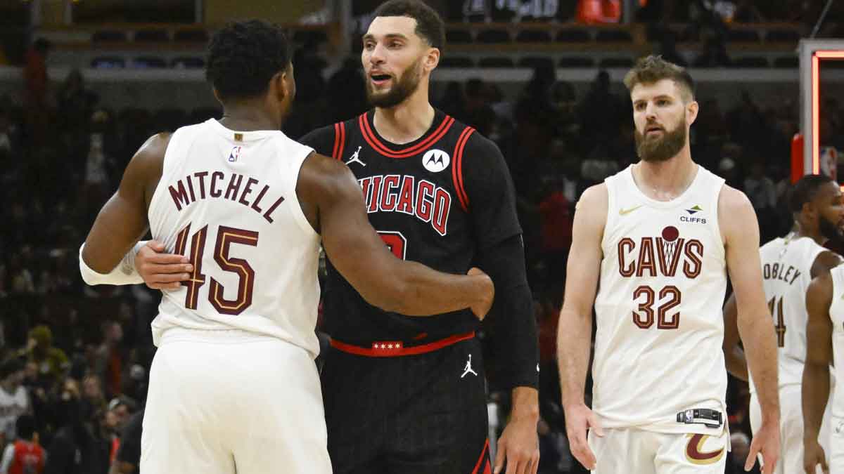 Chicago Bulls guard Zach LaVine (8) is hugged by Cleveland Cavaliers guard Donovan Mitchell (45) after the game at United Center. The Cavaliers' 12-0 start to the season ranks among the best undefeated starts in NBA history.