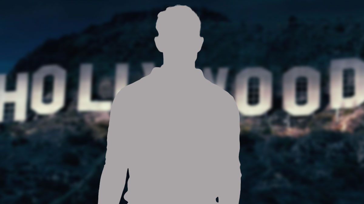 Silhouette of The Office star and People's 2024 Sexiest Man Alive, John Krasinski, in front of Hollywood sign.
