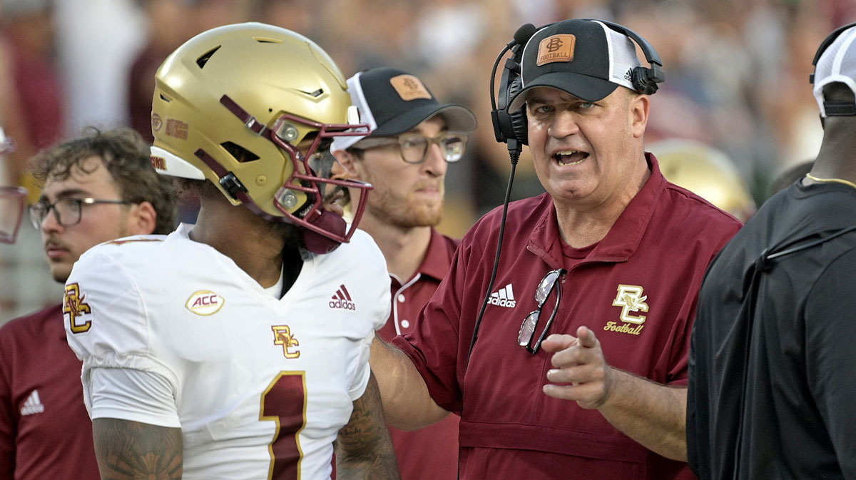 Boston College Eagles quarterback Thomas Castellanos (1) speaks with head coach Bill O'Brien before the game against the Florida State Seminoles at Doak S. Campbell Stadium