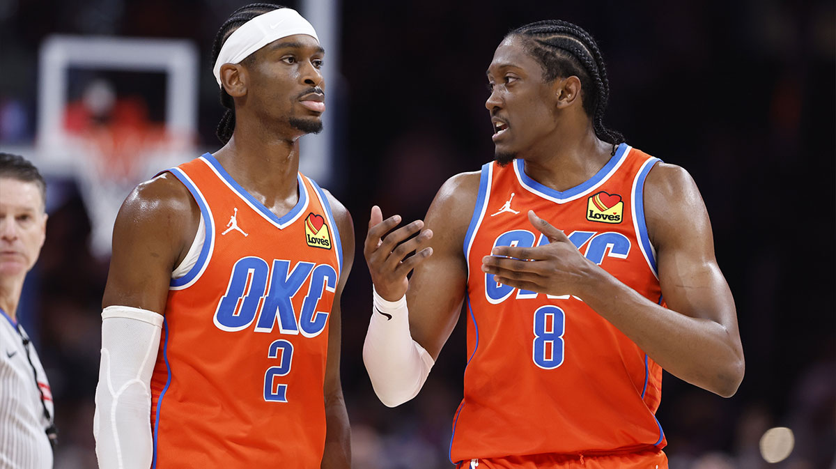 Thunder forward Jalen Williams & Thunder rookie Ajay Mitchell next to the Thunder logo with the Oklahoma City skyline in the background