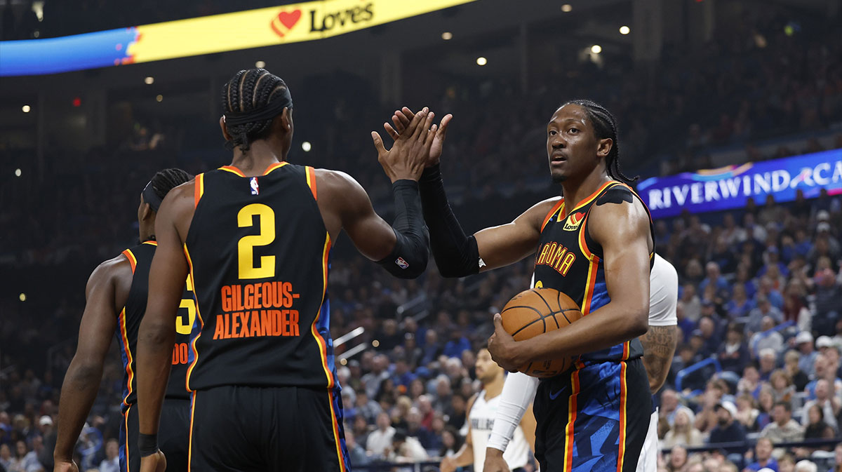 Thunder guard Shai Gilgeous-Alexander (2) and forward Jalen Williams (8) high five after a play against the Dallas Mavericks during the first quarter at Paycom Center
