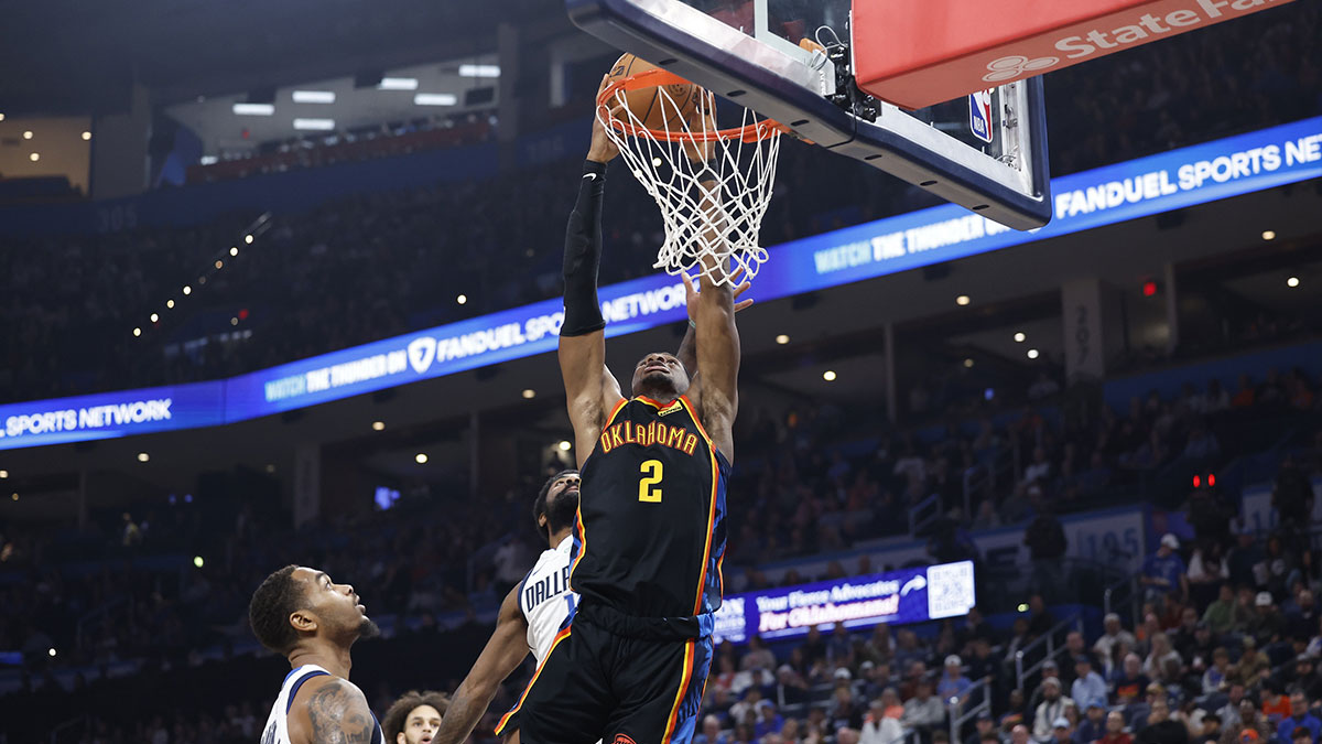 Thunder guard Shai Gilgeous-Alexander (2) dunks against the Dallas Mavericks during the second half at Paycom Center