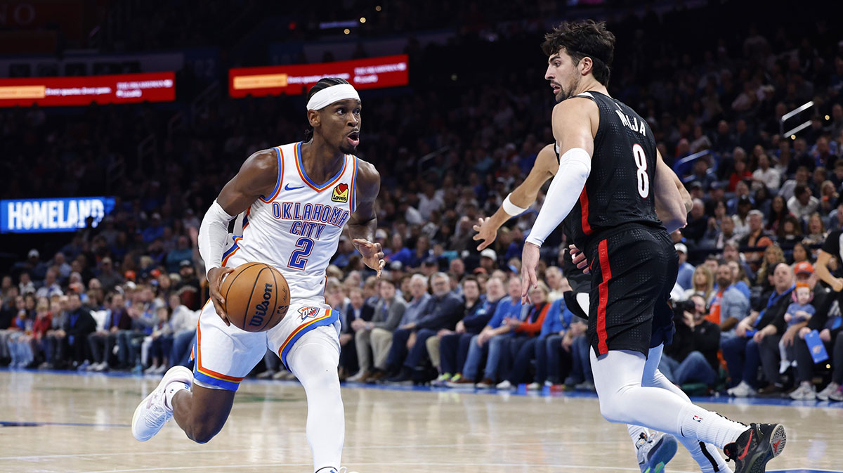 Thunder guard Shai Gilgeous-Alexander (2) drives to the basket against Portland Trail Blazers forward Deni Avdija (8) during the second half at Paycom Center