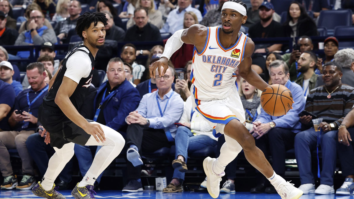 Thunder guard Shai Gilgeous-Alexander (2) moves around Portland Trail Blazers guard Shaedon Sharpe (17) during the second half at Paycom Center