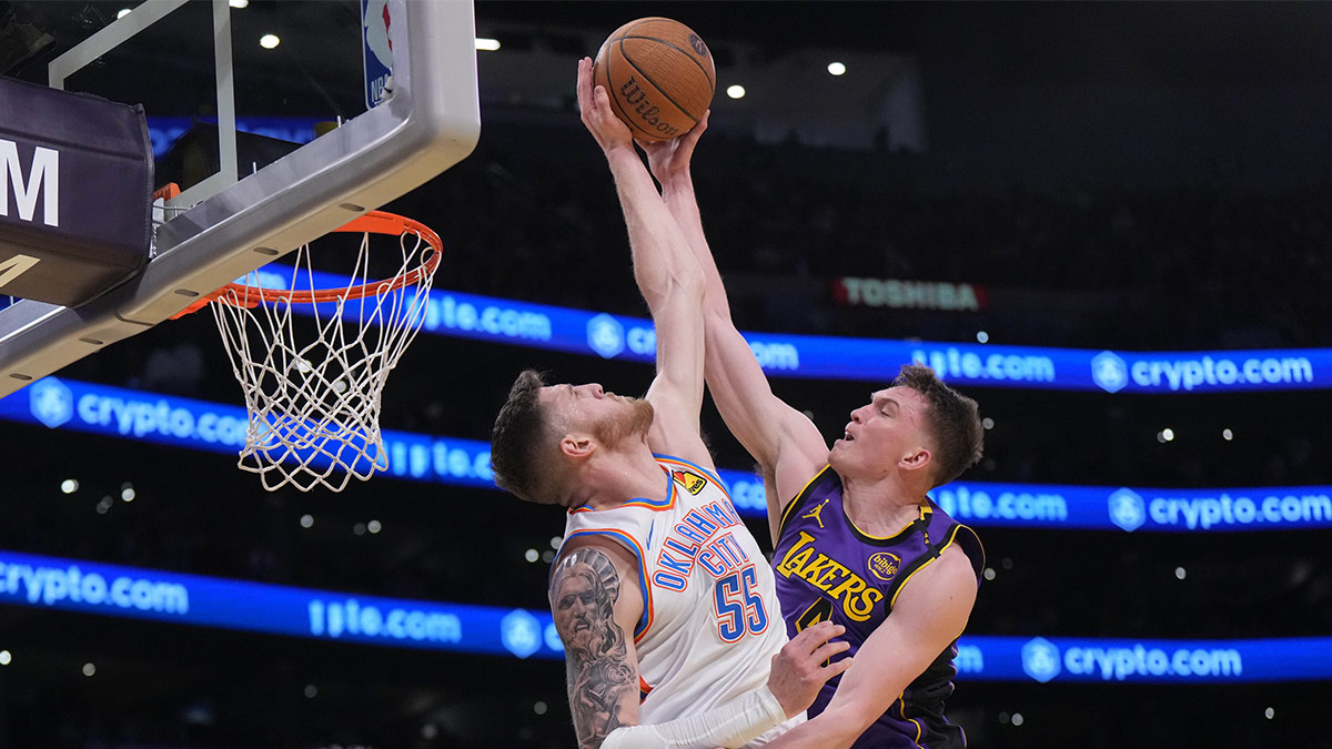 Lakers guard Dalton Knecht (4) shoots against Oklahoma City Thunder center Isaiah Hartenstein (55) in the first half at Crypto.com Arena