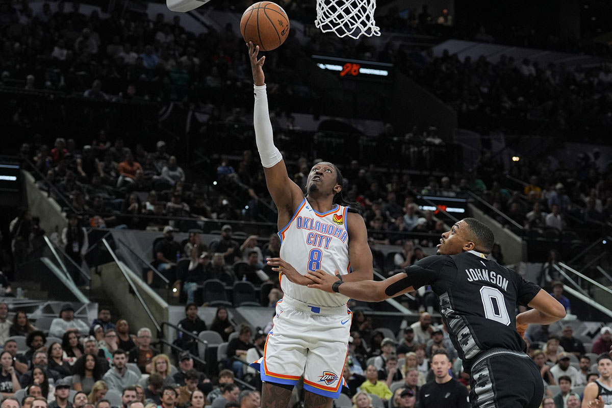 Thunder forward Jalen Williams (8) shoots over San Antonio Spurs forward Keldon Johnson (0) in the second half at Frost Bank Center