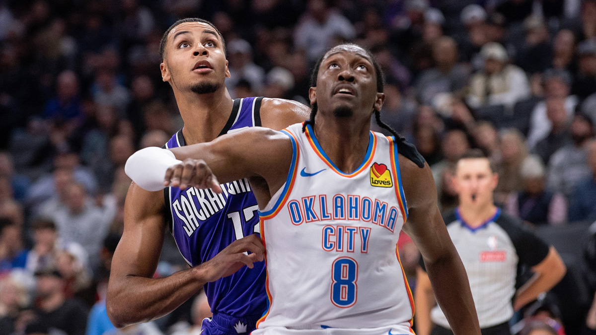 Thunder forward Jalen Williams (8) and Sacramento Kings forward Keegan Murray (13) fight for position under the basket during the second quarter at Golden 1 Center