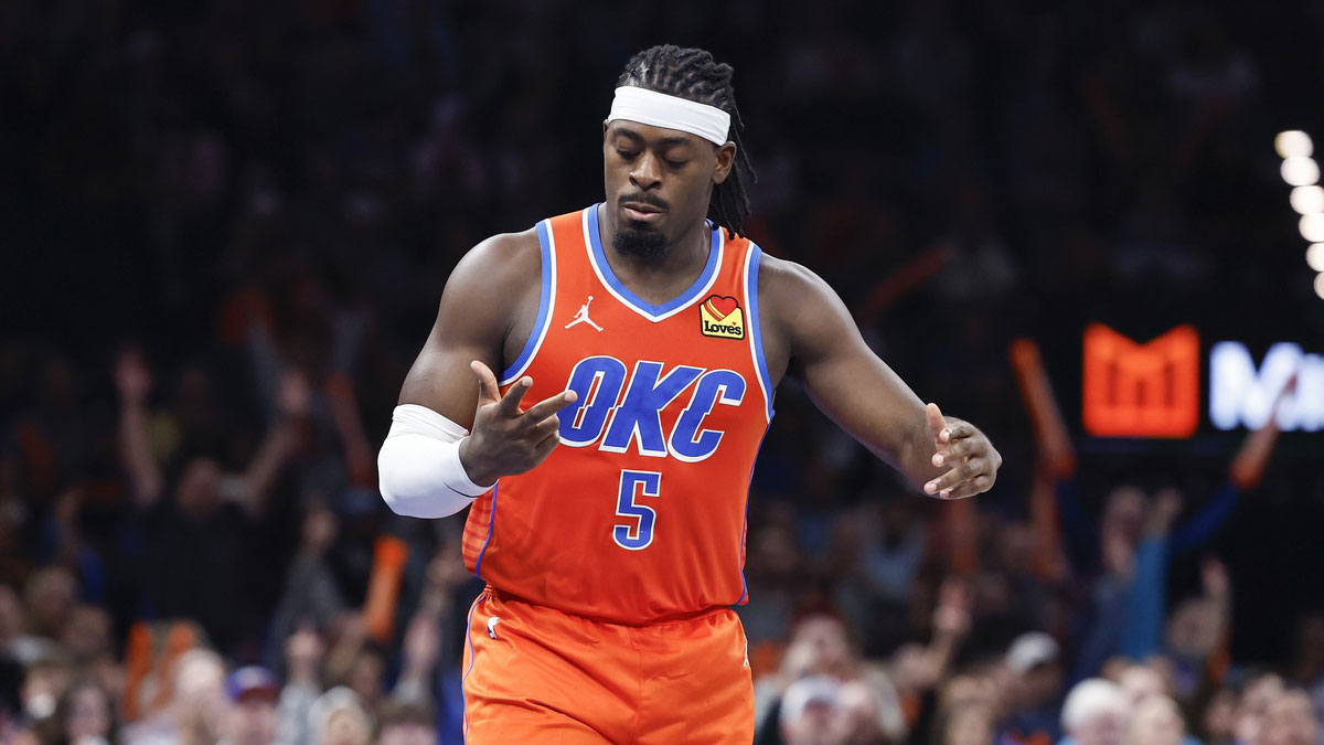 Thunder guard Luguentz Dort (5) gestures after scoring a three point basket against the Phoenix Suns during the fourth quarter at Paycom Center