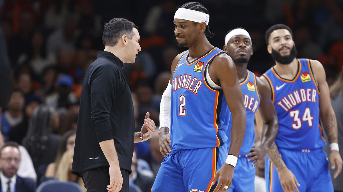 Thunder guard Shai Gilgeous-Alexander (2) and head coach Mark Daigneault talk during a time out against the New Orleans Pelicans during the second quarter at Paycom Center