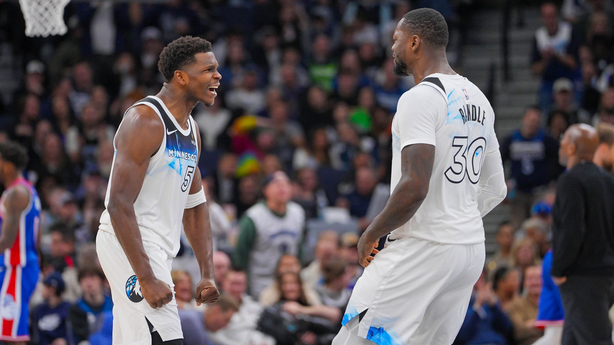 Timberwolves guard Anthony Edwards (5) and forward Julius Randle (30) celebrate against the Sacramento Kings in the fourth quarter at Target Center