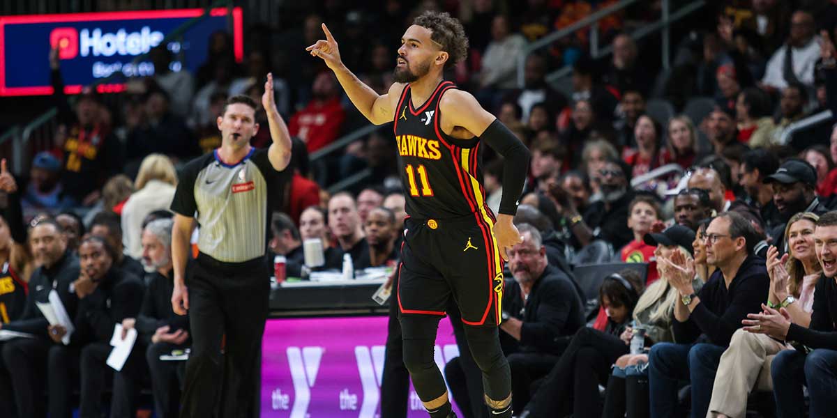 Atlanta Hawks guard Trae Young (11) celebrates shot against the Cleveland Cavaliers during the fourth quarter at State Farm Arena.