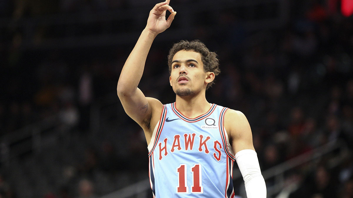 Atlanta Hawks guard Trae Young (11) motions skyward before a game against the Oklahoma City Thunder at State Farm Arena.