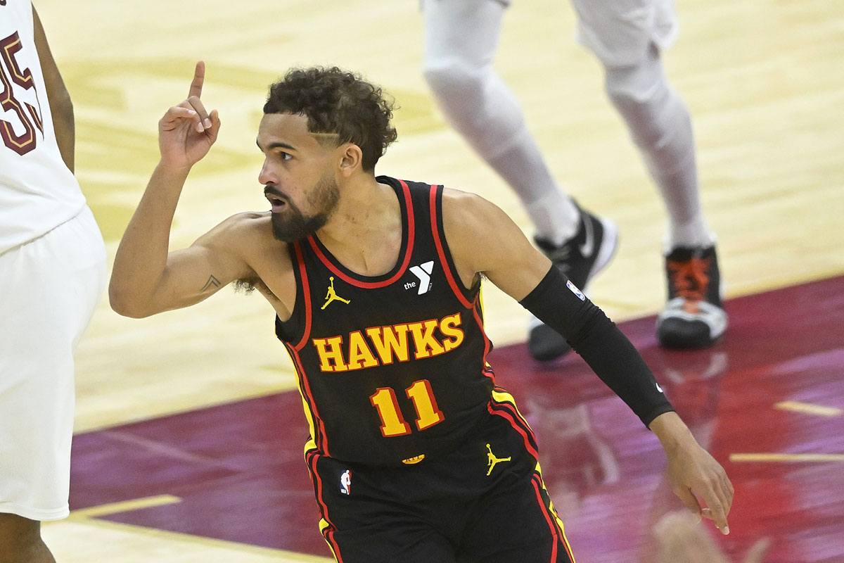 Atlanta Hawks guard Trae Young (11) celebrates his three-point basket in the fourth quarter against the Cleveland Cavaliers at Rocket Mortgage FieldHouse.