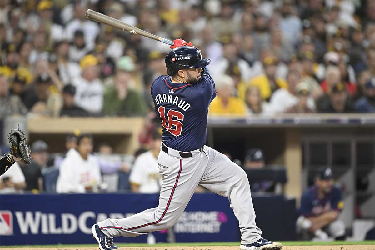 Atlanta Braves catcher Travis d'Arnaud (16) hits a double against the San Diego Padres during the fourth inning in game one of the Wildcard round for the 2024 MLB Playoffs at Petco Park.