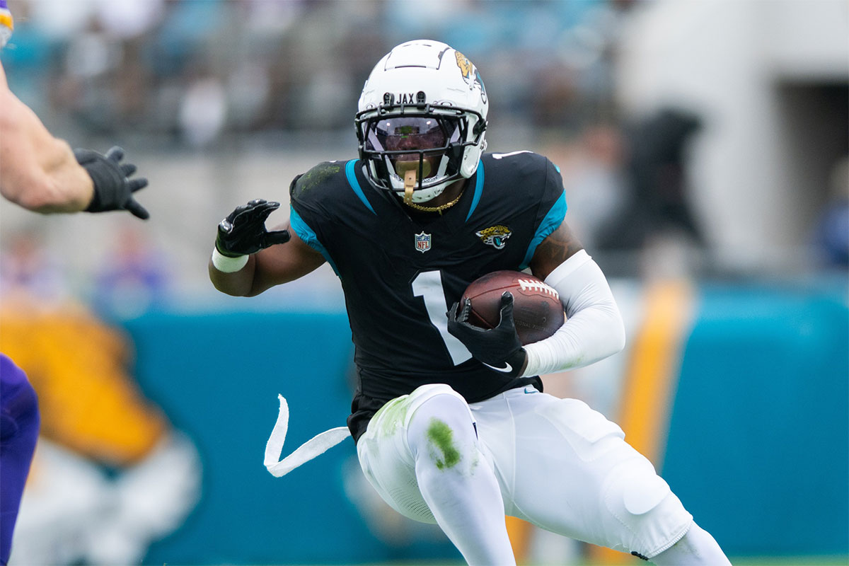 Jacksonville Jaguars running back Travis Etienne Jr (1) runs the ball after the catch agains the Minnesota Vikings in the first quarter at EverBank Stadium.