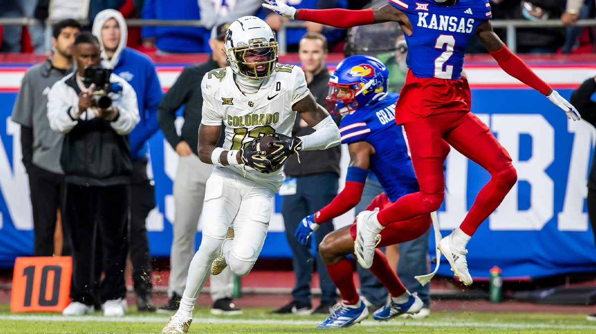 Colorado wide receiver Travis Hunter (12) catches the ball ahead of Kansas cornerback Cobee Bryant (2) for a touchdown during the 3rd quarter between the Kansas Jayhawks and the Colorado Buffaloes at GEHA Field at Arrowhead Stadium.