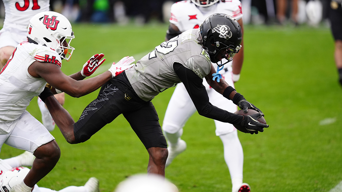 Colorado Buffaloes wide receiver Travis Hunter (12) dives for touchdown in the fourth quarter against the Utah Utes at Folsom Field.