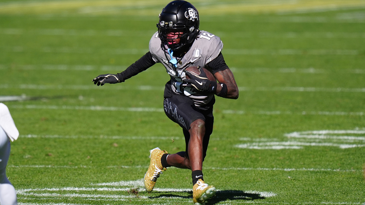 Nov 16, 2024; Boulder, Colorado, USA; Colorado Buffaloes wide receiver Travis Hunter (12) carries the ball in the second quarter against the Utah Utes at Folsom Field.