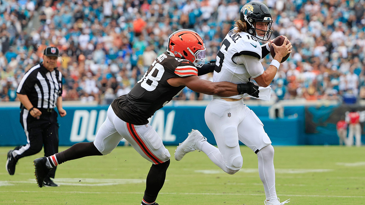 Jacksonville Jaguars quarterback Trevor Lawrence (16) is wrapped up by Cleveland Browns linebacker Jordan Hicks (58) during the second quarter of an NFL football matchup Sunday, Sept. 15, 2024 at EverBank Stadium in Jacksonville, Fla. The Browns defeated the Jaguars 18-13.