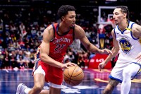 New Orleans Pelicans guard Trey Murphy III (25) dribbles against Golden State Warriors forward Lindy Waters III (43) during first half at Smoothie King Center.