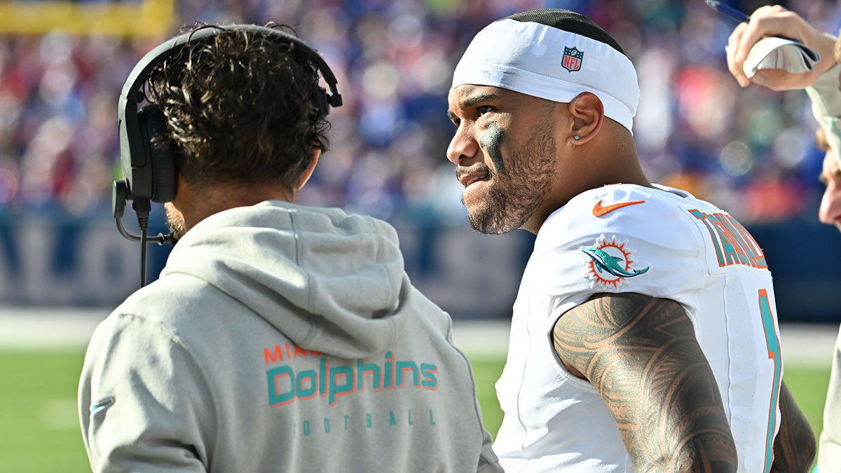 Miami Dolphins quarterback Tua Tagovailoa (1) on the sidelines with head coach Mike McDaniel in the second quarter game against the Buffalo Bills at Highmark Stadium.