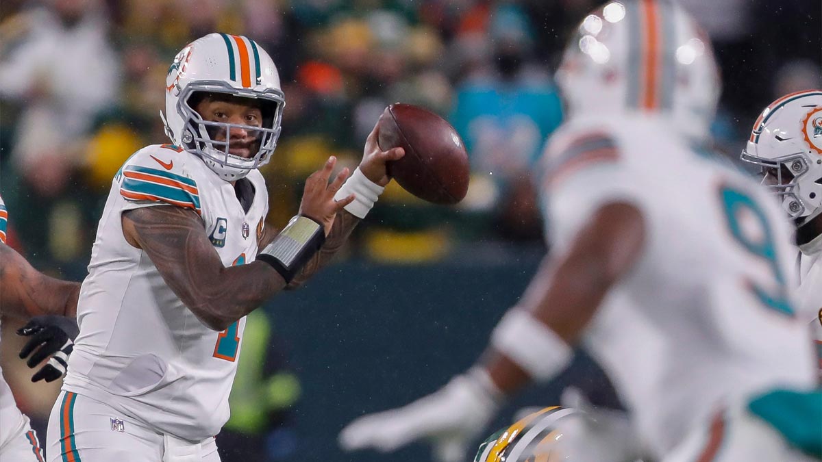 Miami Dolphins quarterback Tua Tagovailoa (1) drops back to pass against the Green Bay Packers on Thursday, November 28, 2024, at Lambeau Field in Green Bay, Wis. The Packers won the game, 30-17.