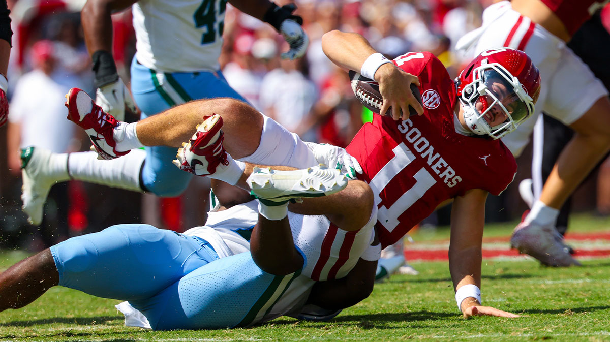 ulane Green Wave linebacker Sam Howard (15) tackles Oklahoma Sooners quarterback Jackson Arnold (11) during the first quarter at Gaylord Family-Oklahoma Memorial Stadium.