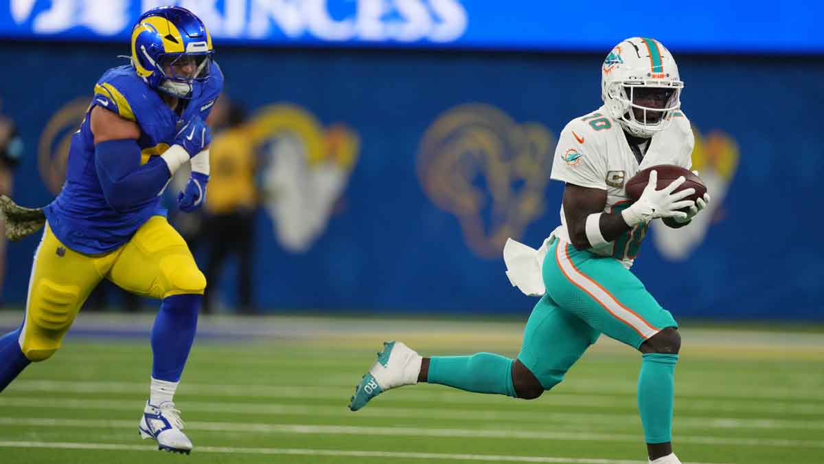 Miami Dolphins wide receiver Tyreek Hill (10) catches the ball against the Los Angeles Rams in the first half at SoFi Stadium