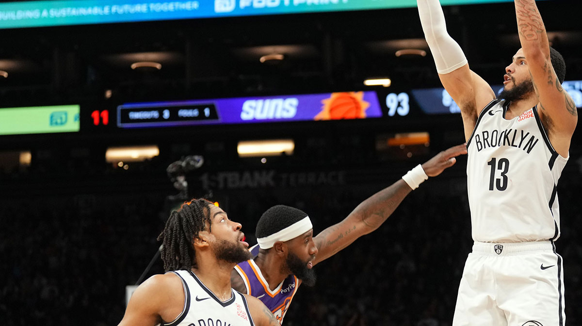 Brooklyn Nets guard Tyrese Martin (13) shoots over Phoenix Suns forward Royce O'Neale (00) during the second half at Footprint Center.