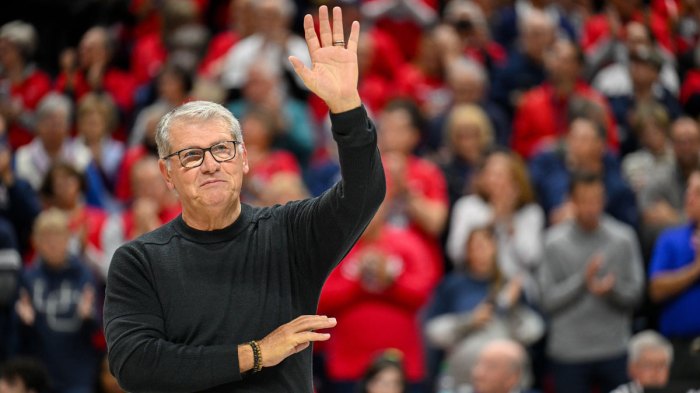 Connecticut Huskies head coach Geno Auriemma waves to the crowd before a game between the Connecticut Huskies and the Fairleigh Dickinson Knights at Harry A. Gampel Pavilion