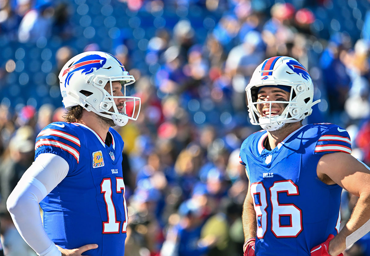 Buffalo Bills quarterback Josh Allen (17) and tight end Dalton Kincaid (86) have a word before a game against the Tennessee Titans at Highmark Stadium.