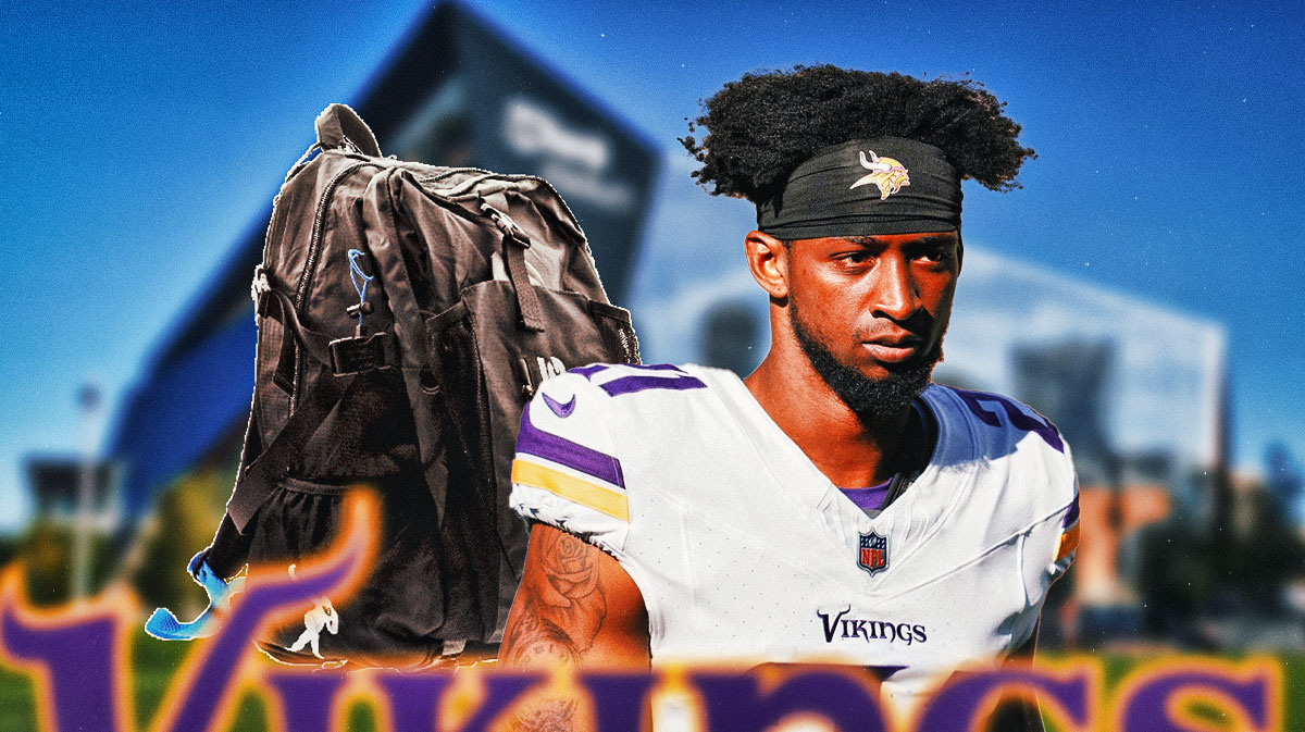 Minnesota Vikings cornerback Akayleb Evans with a backpack and looking away from US Bank Stadium