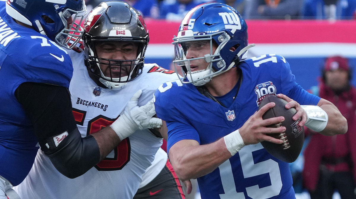 East Rutherford, NJ -- November 24, 2024 -- Vita Vea of Tampa Bay chases Tommy DeVito of the Giants in the first half as the Tampa Bay Buccaneers came to MetLife Stadium to play the New York Giants.