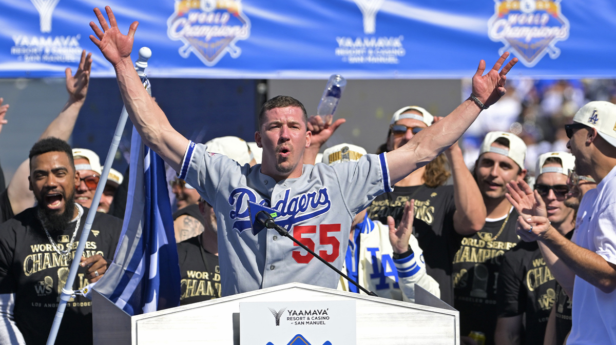 Los Angeles Dodgers starting pitcher Walker Buehler (21) speaks to fans during the World Series Championship Celebration at Dodger Stadium.