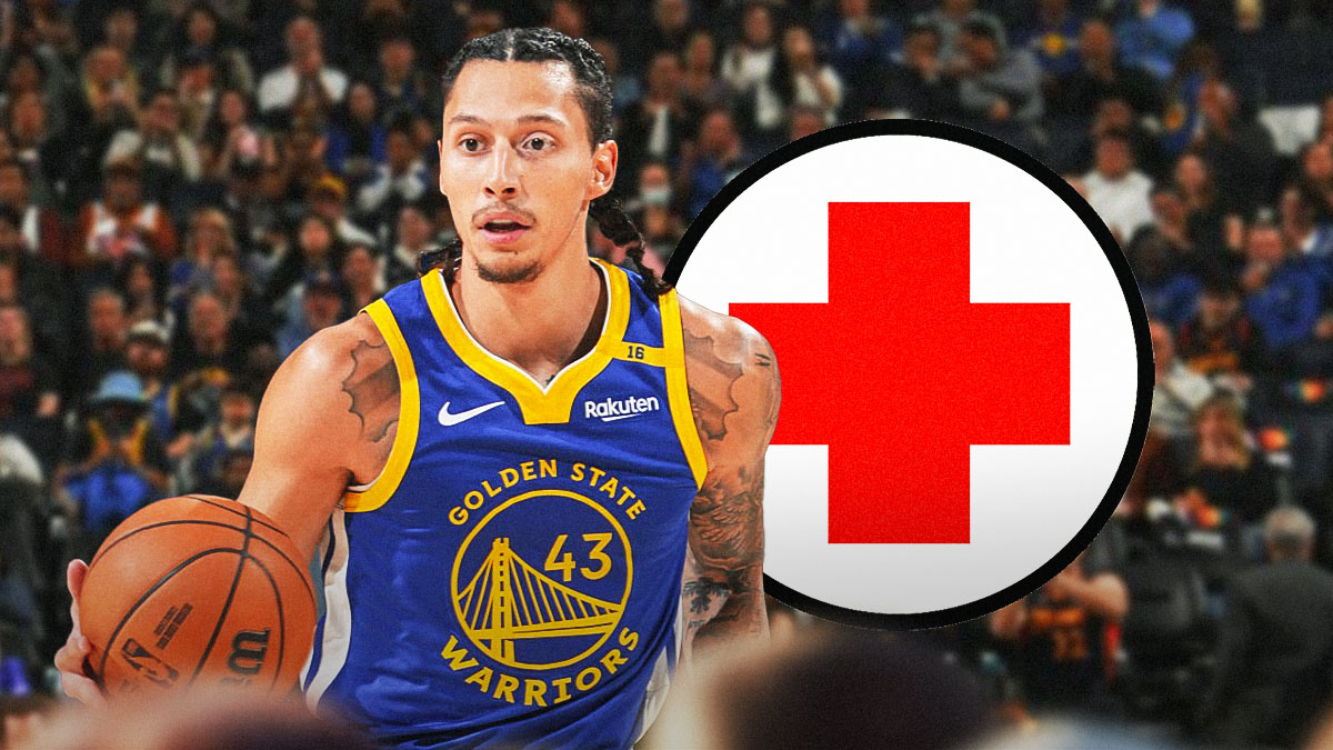 Warriors' Lindy Waters III with medical Red Cross symbol