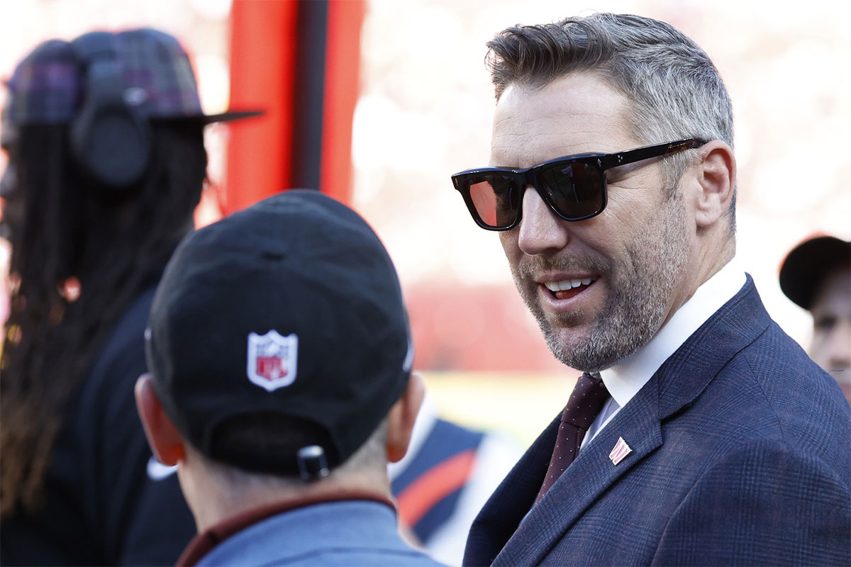 Washington Commanders general manager Adam Peters stands on the sidelines against the Cleveland Browns during the fourth quarter at NorthWest Stadium.