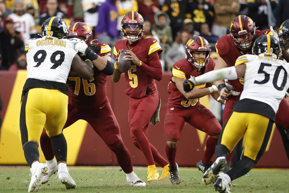 Washington Commanders quarterback Jayden Daniels (5) prepares to throw the ball during the second half against the Pittsburgh Steelers at Northwest Stadium.