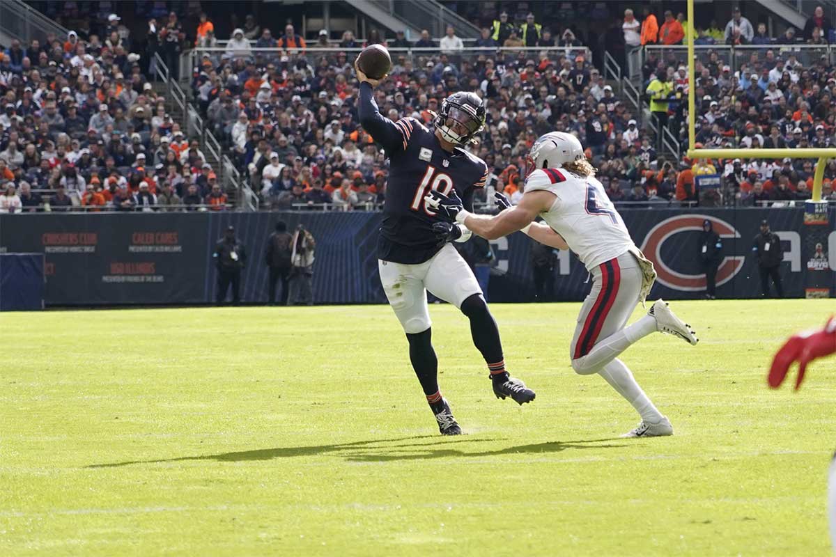 Chicago Bears quarterback Caleb Williams (18) passes against the New England Patriots during the first half at Soldier Field.