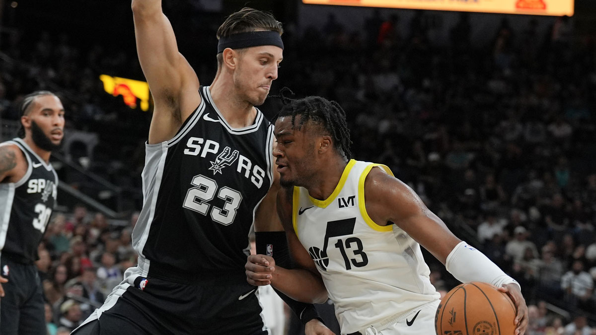 Utah Jazz guard Isaiah Collier (13) drives in against San Antonio Spurs forward Zach Collins (23) in the first half at Frost Bank Center.