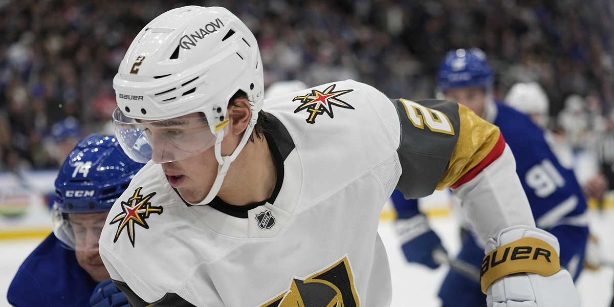 Vegas Golden Knights defenseman Zach Whitecloud (2) tries to control the puck against the Toronto Maple Leafs during the first period at Scotiabank Arena.