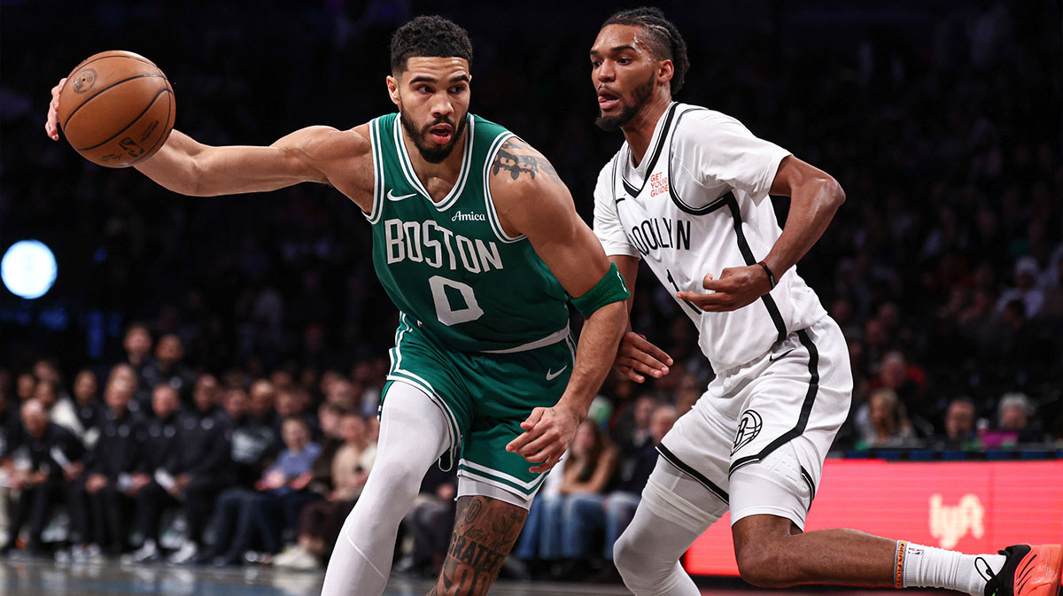 Boston Celtics forward Jayson Tatum (0) loses control of the ball as Brooklyn Nets forward Ziaire Williams (1) defends during the first half at Barclays Center.