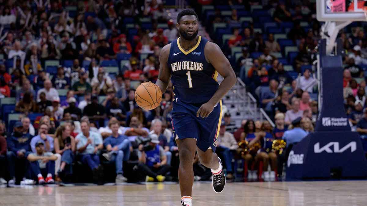 New Orleans Pelicans forward Zion Williamson (1) dribbles against the Cleveland Cavaliers during the first half at Smoothie King Center.